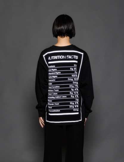 The model is wearing a long sleeve black tshirt from Sea Of Sound by Gavin Rossdale with the Nutrition Facts logo on the back.