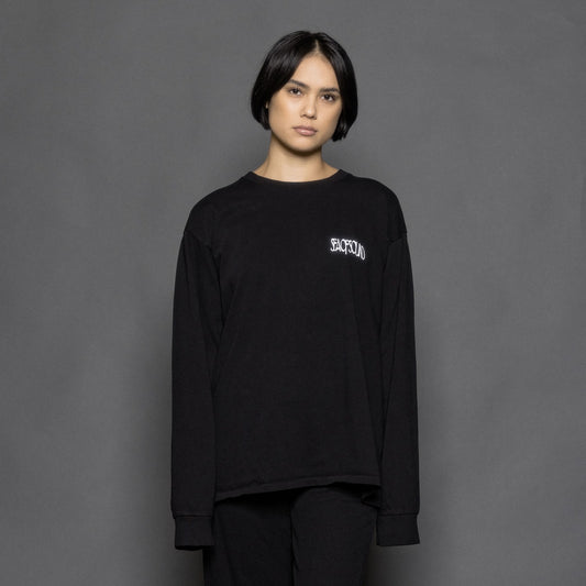 The model is wearing a long sleeve black tshirt from Sea Of Sound by Gavin Rossdale with the main Sea Of Sound logo on the left breast.