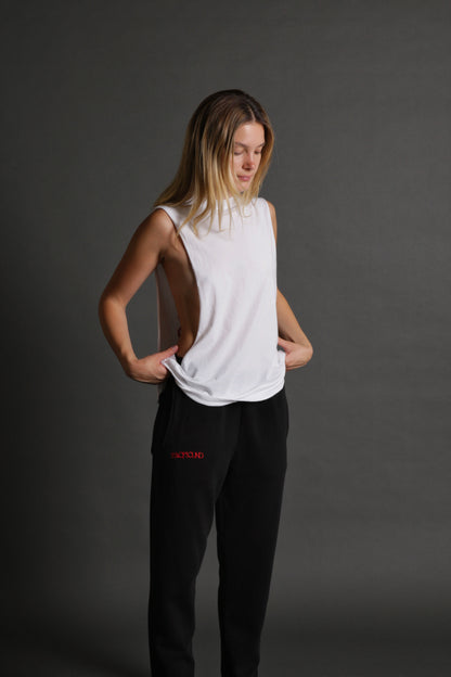 The model is wearing the white and red stage tank from Sea Of Sound by Gavin Rossdale with a blank front.